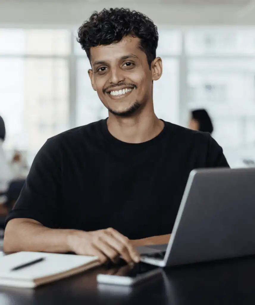 Freelance SEO specialist Aswin Gopan Working on a laptop
